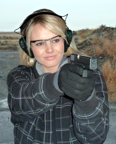 A female shooting a pistol